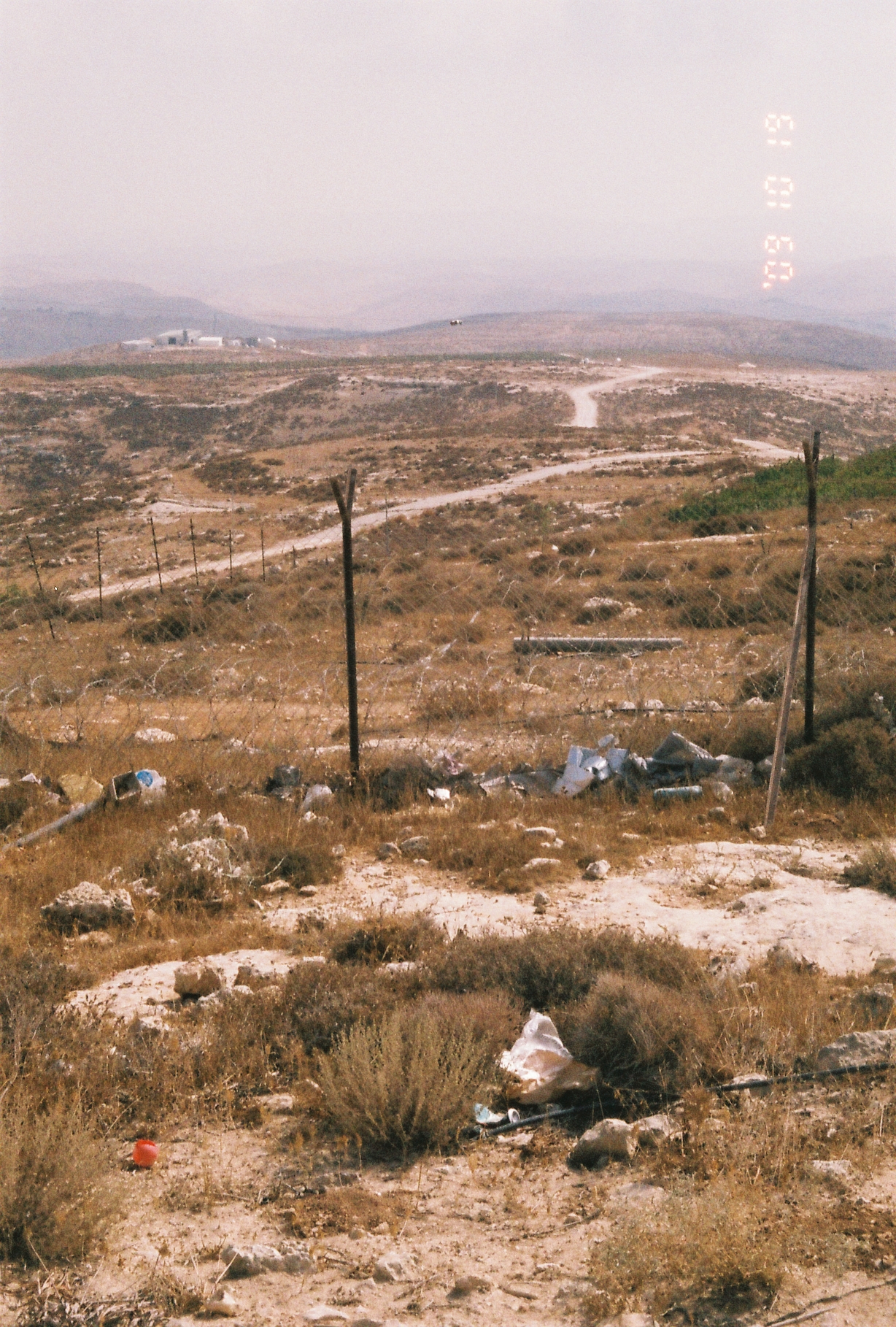 Inside an Israeli settlement in Al-Khalil, Hebron. Barbed wire maps the border of settlement, and path to another facility a part of the settlement.